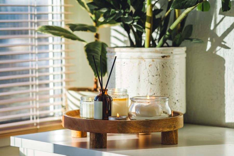 A collection of home care scent solutions on a table.
